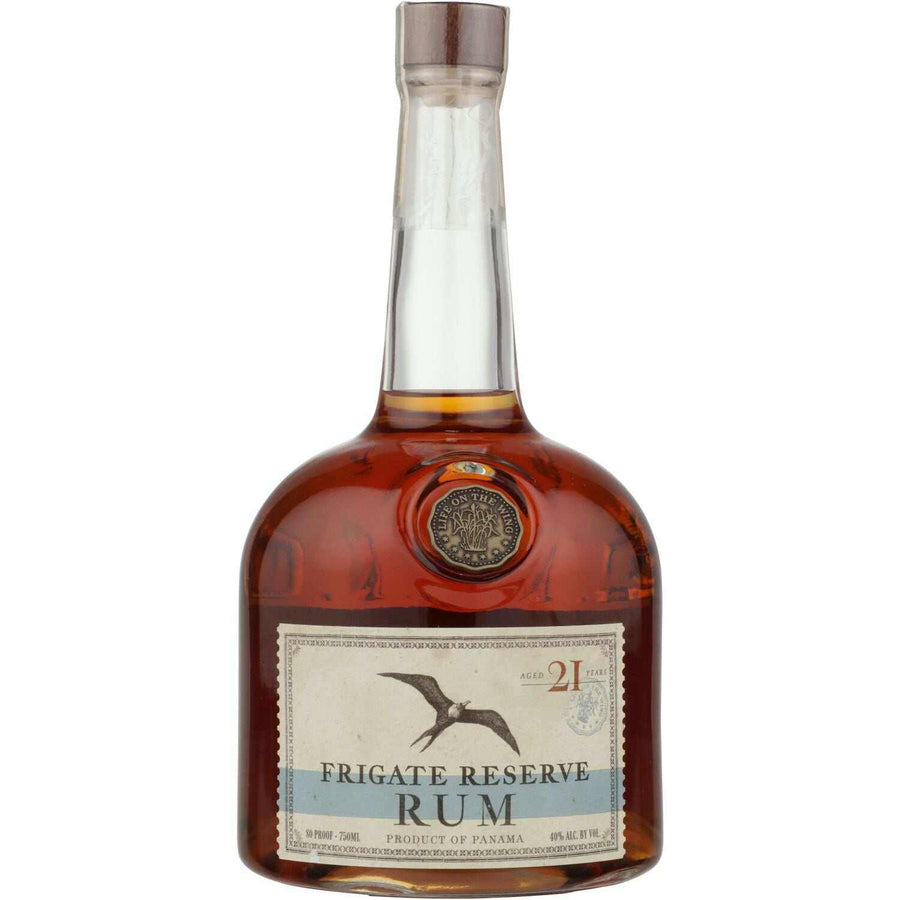 Frigate Reserve Aged Rum 21 Year bottle with label featuring a flying bird motif, showcasing its premium Dominican heritage.