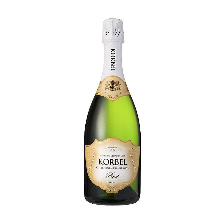 Korbel Brut Champagne California 750 ML bottle with sparkling wine and citrus fruits background