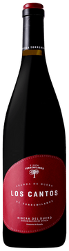 Bottle of Los Cantos wine with a red label on a white background