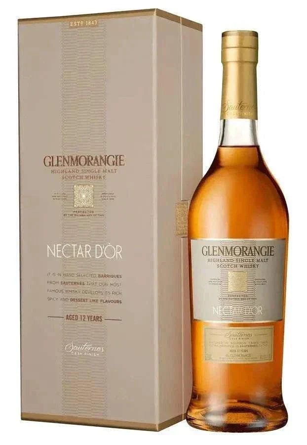 Glenmorangie Single Malt Scotch The Nectar D'Or bottle next to its elegant box.
