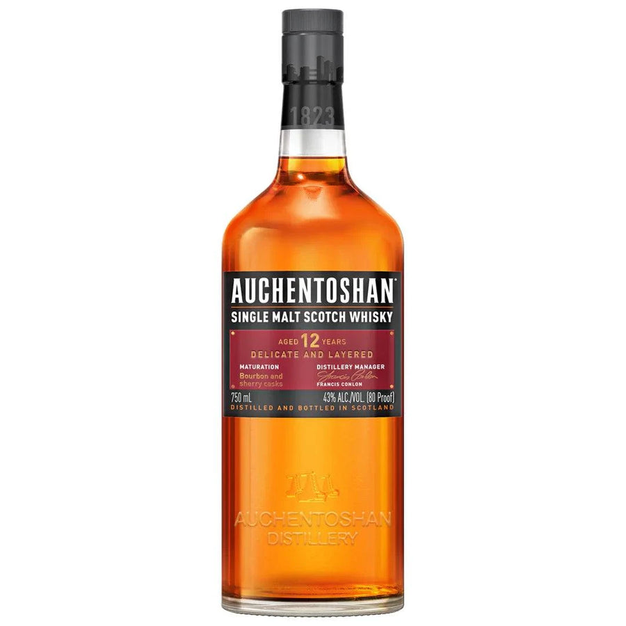 Bottle of Auchentoshan Single Malt Scotch 12 Year 750ml with golden amber whisky inside